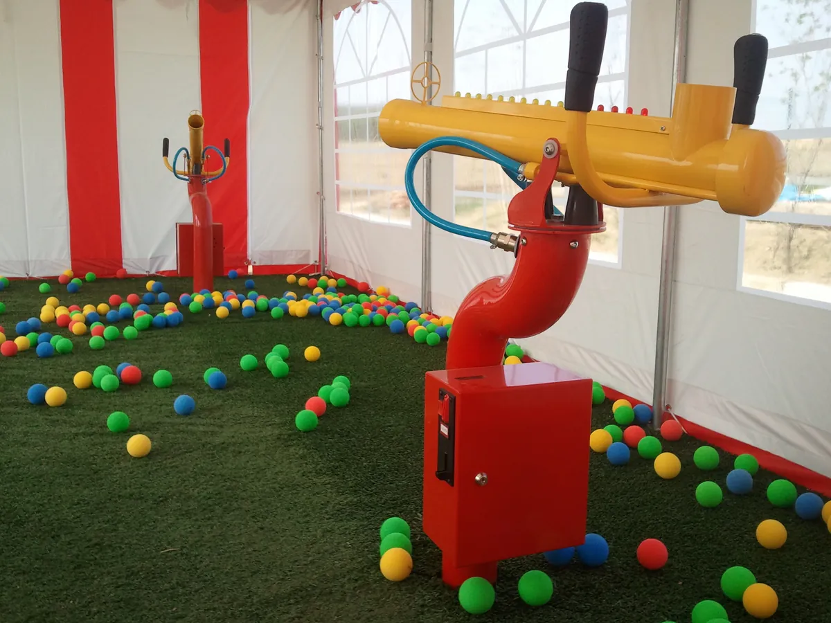 Soft ball cannons for indoor playgrounds