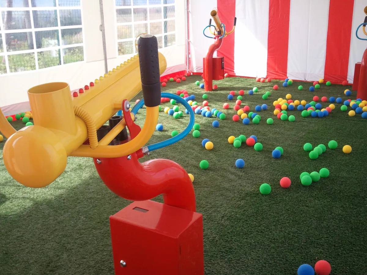 Soft ball cannons for indoor playgrounds