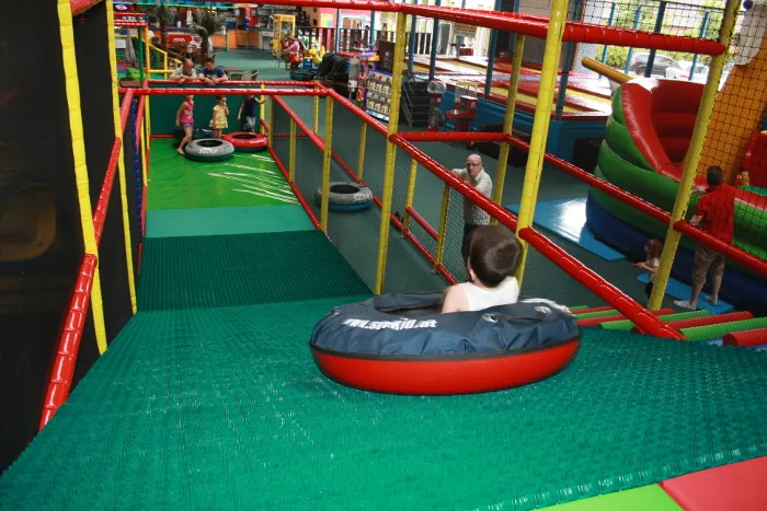 Donut glider for indoor playgrounds