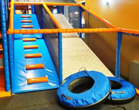 Donut glider for indoor playgrounds